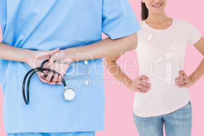 Composite image of rear view of female surgeon holding stethoscope