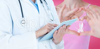 Composite image of doctor using tablet pc