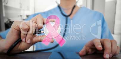 Composite image of midsection of female doctor examining mobile phone with stethoscope
