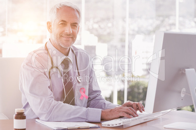 Composite image of breast cancer awareness ribbon