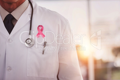 Composite image of doctor wearing lab coat