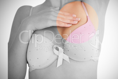 Mid section of woman in bra for breast cancer awareness