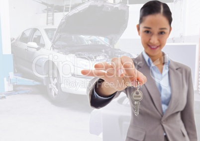 Woman  Holding key in front of car