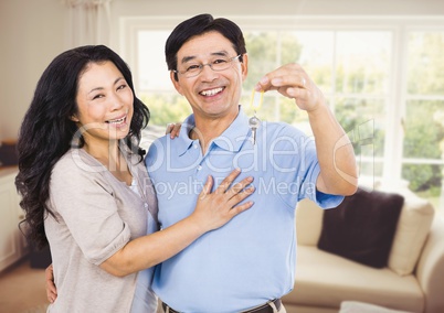 Couple Holding key in sitting room