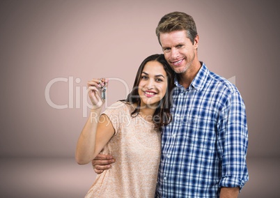 Couple Holding key in front of vignette