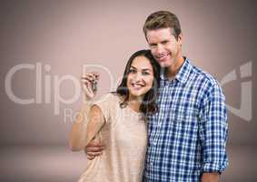 Couple Holding key in front of vignette