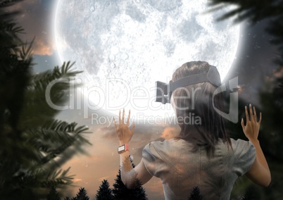 woman with VR glasses forest at night with big moon
