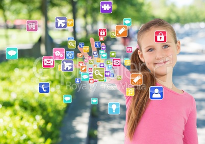 Girl with hand spread of  and application icons coming up from it. In the park