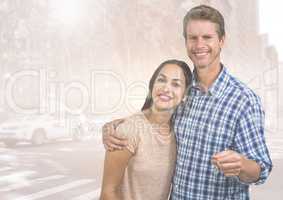 Couple  Holding key in front of street road cars