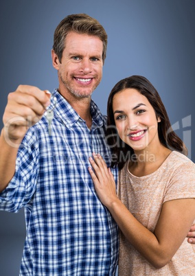 Couple Holding key in front of vignette