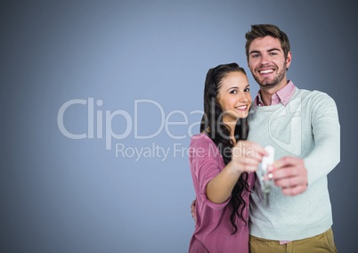 Couple Holding key in front of vignette