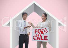 Two people holding For Sale sign and keys  with house icon in front of vignette