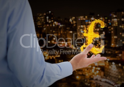 hand with pounds  fire icon over in front of the city at night