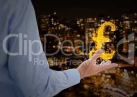 hand with pounds  fire icon over in front of the city at night
