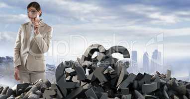 Broken concrete stone with money symbol and businesswoman with magnifying glass in cityscape