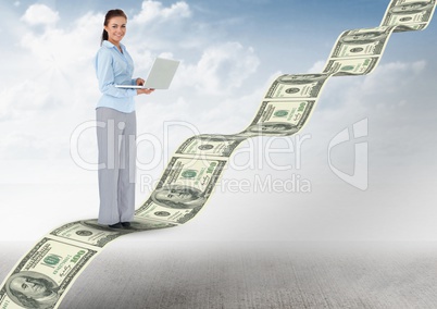 texting money. young businesswoman with laptop in money stairs