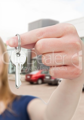 Woman Holding Keys with cars