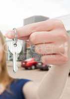 Woman Holding Keys with cars