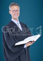 Male judge with open book against blue background