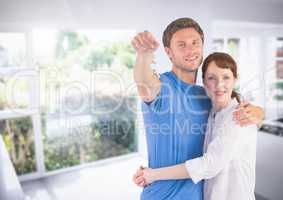Couple Holding key in kitchen