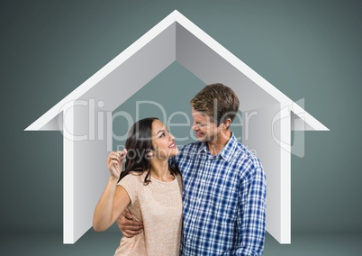 Couple Holding key with house icon in front of vignette