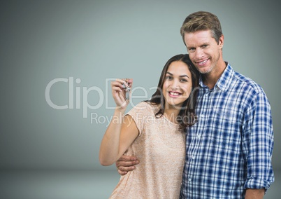 Couple Holding key in front of vignette