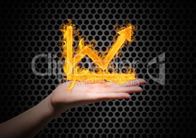 hand with graph fire icon over. Iron wall background