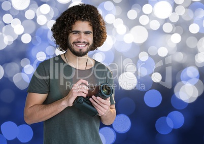 photographer with camera on hands. Blue and white bokeh background