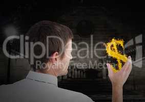 man with dolar fire icon on hand in the city at night