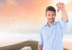 Man  Holding key in front of road