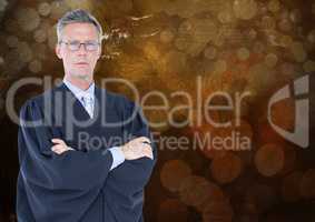 Male judge arms folded against brown bokeh