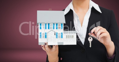 Woman Holding key and house in front of vignette