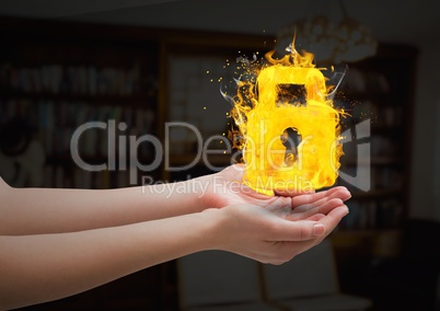 hands with lock fire icon over in the living room.