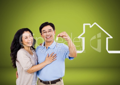 Couple Holding key with house icon in front of vignette