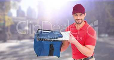 Delivery man with blue bag against blurry street with flares