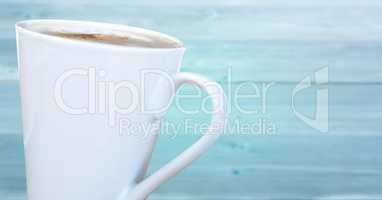 White coffee cup against blurry blue wood panel