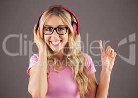 Millennial woman with headphones against brown background