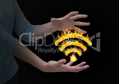 woman hands with WIFI fire icon between. Black background