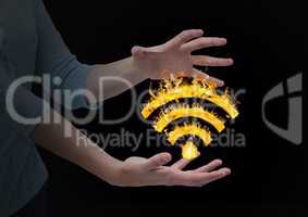 woman hands with WIFI fire icon between. Black background