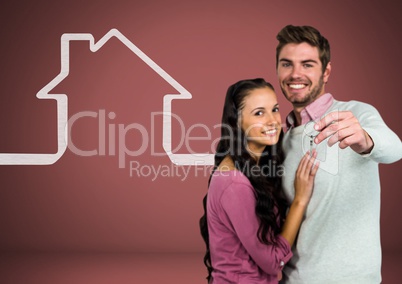 Couple Holding key with house icon in front of vignette