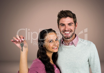 Couple Holding key in front of vignette