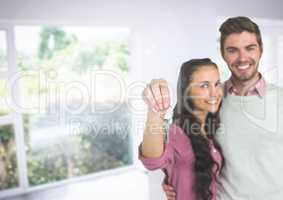 Couple Holding Keys  in home