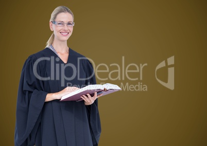 Female judge with book against green background