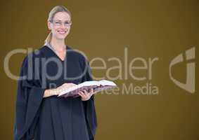 Female judge with book against green background