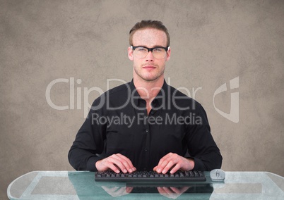 Nerd man at desk against brown background with grunge overlay