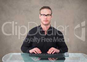 Nerd man at desk against brown background with grunge overlay