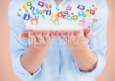hands with application icons. (orange background)