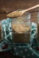 Grains in wooden spoon