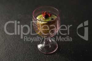 Dried fruits and granola bar in glass
