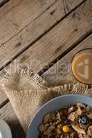 Wheat flakes with blueberry and golden berry in bowl